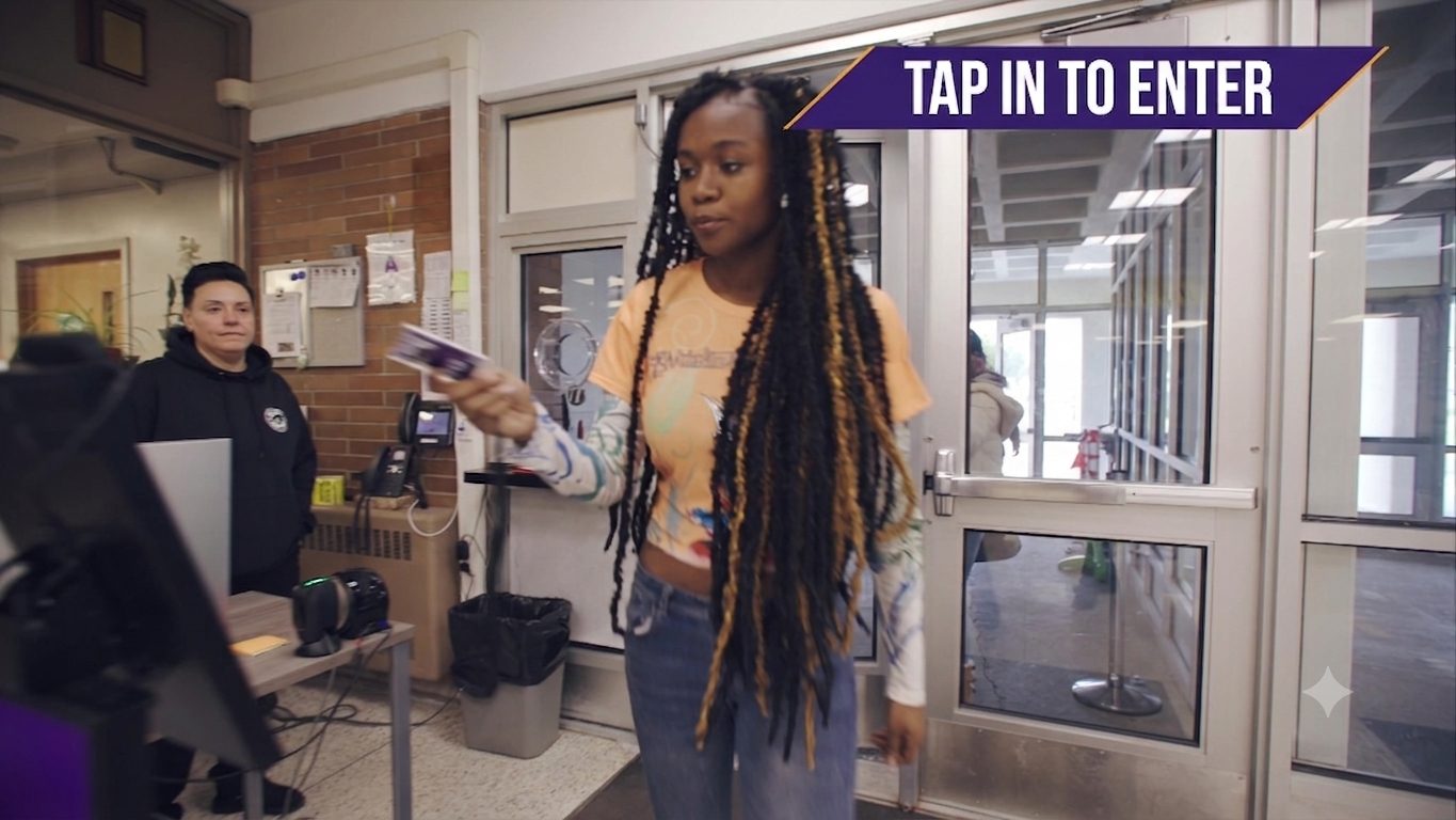 A MOOV student ID card tapped at a building entrance