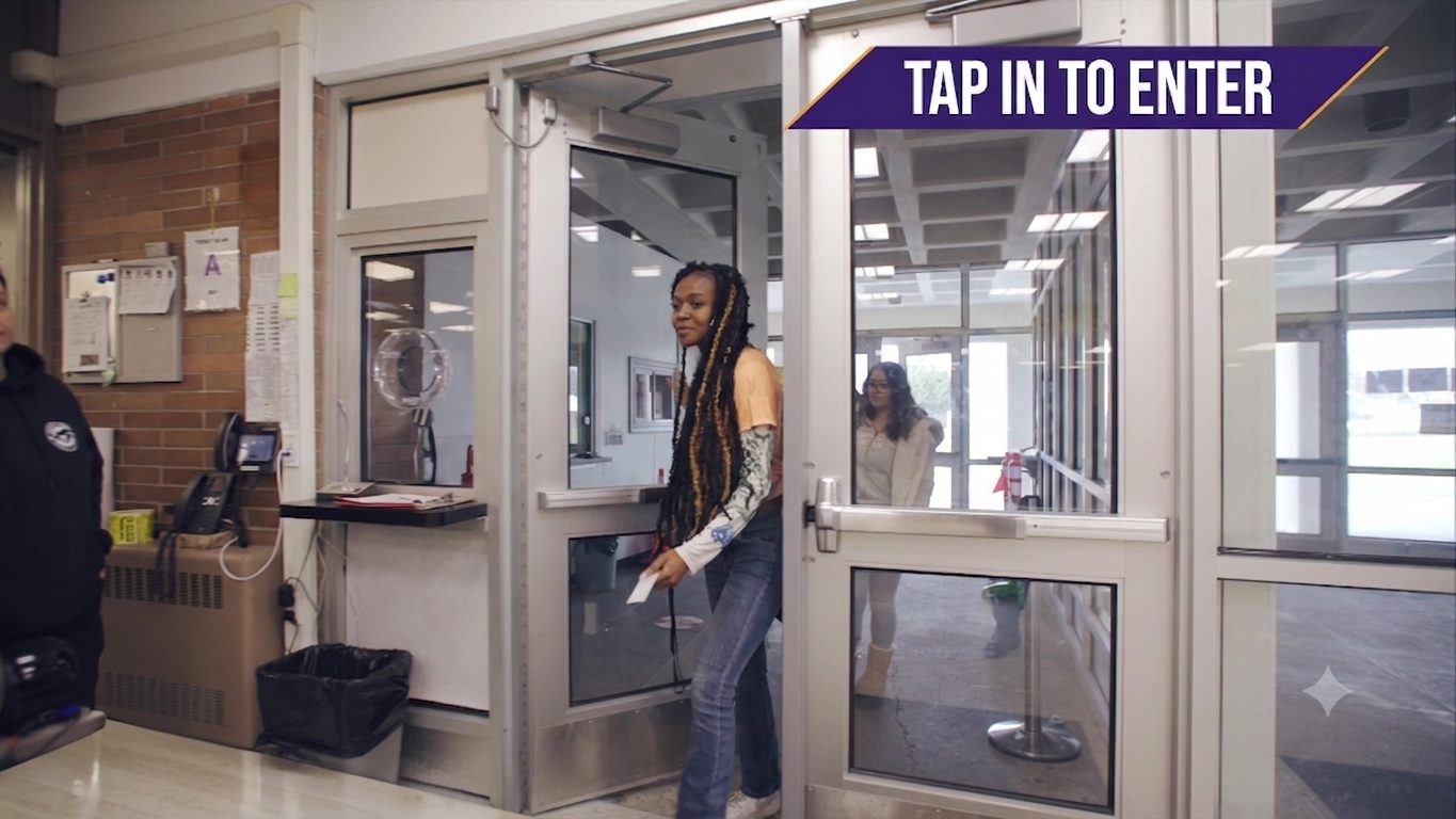 Several MOOV kiosks with multiple student lines at a large entrance