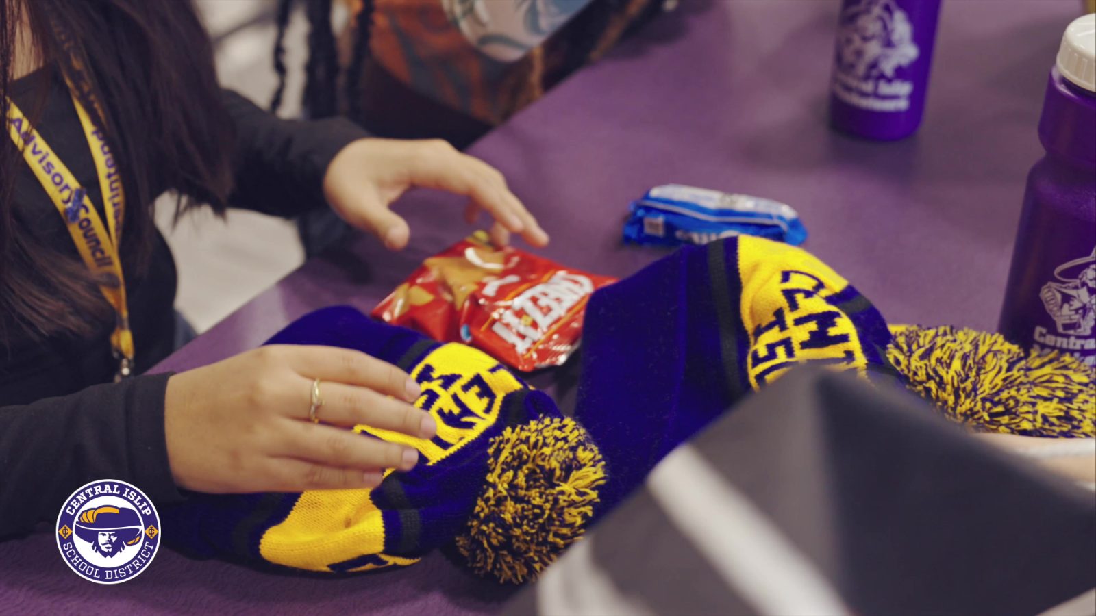 Students choosing Central Islip spirit gear and snacks from the Tap Store
